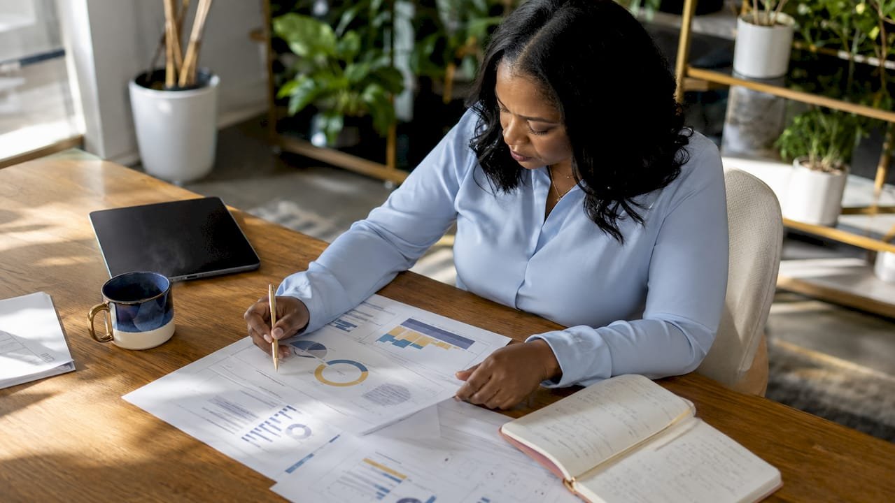 Business leader reviewing outcome reports in office